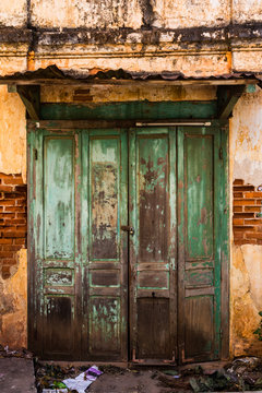 Vintage old door with brick wall