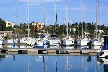 Tuinposter yacht and boat reflections in marina harbour © William Richardson