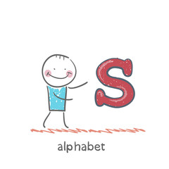 man standing with a letter of the alphabet