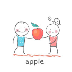 girl and boy holding an apple