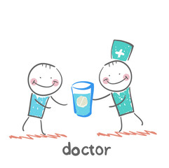 Doctor giving a pill