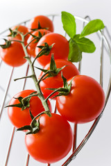 fresh red tomatoes with basil leaf