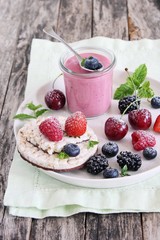 Healthy breakfast with dietary rice waffles, yogurt and berries.