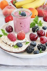 Healthy breakfast with dietary rice waffles, yogurt and berries.