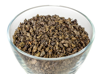 Loose green gunpowder tea in glass bowl