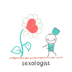 Sexologist stands near a large flower with a heart