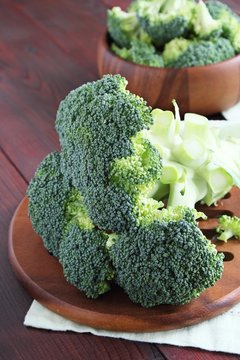 Fresh broccoli on a rustic wooden table.