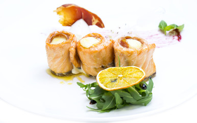 baked salmon rolls on a table in a restaurant