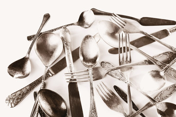 Old disordered tableware closeup