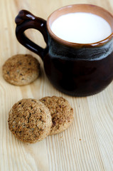 Oatmeal mini cookies and mug with milk