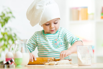 little baker kid girl in chef hat