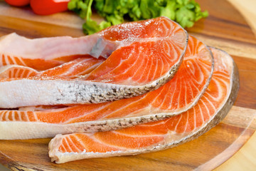 Delicious  portion of fresh salmon fillet with vegetables on