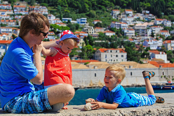 Fototapeta na wymiar father and kids on vacation in Europe