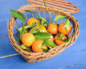 small basket full of mandarin oranges