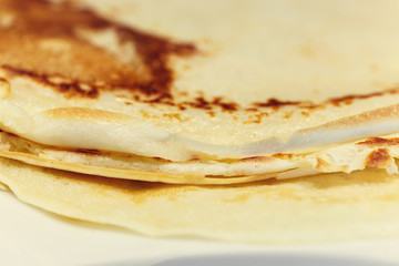 Sweet pancake on white plate