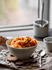 pumpkin porridge with milk in white piala breakfast