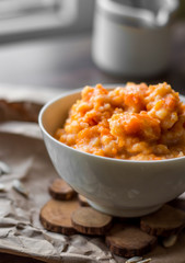 pumpkin porridge with milk in white piala breakfast