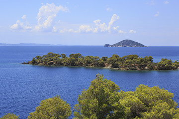 Kelyfos Island on the horizon of Aegean Sea.