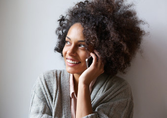 Cheerful young woman talking on mobile phone