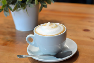 Cappuccino Cup On The Wooden Table