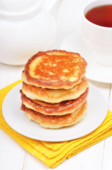 Breakfast with curd pancakes and tea