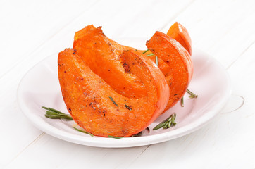 Baked pumpkin slices with honey and herbs