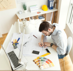 Young architect at his studio