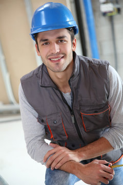 Young construction worker on site