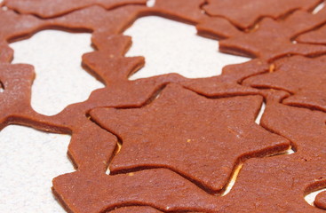 Dough for cookies in shape of christmas tree and star