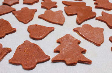 Dough for cookies in shape of christmas tree, heart and bell