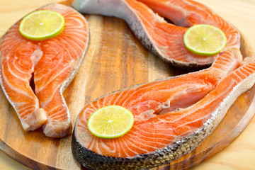 Fresh salmon fillet with lemon - healthy food concept