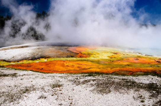 Steam rising from a boiling river in Yellowstone national park