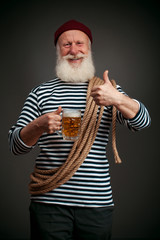 Handsome sailor isolated. Seaman with beer