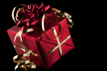 Red gift on a black background