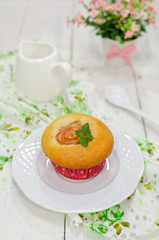Apple muffins with fresh apples on a wooden background