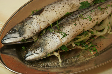 raw fish tucked onions and greens