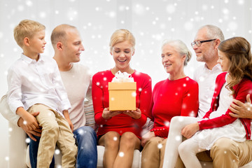 smiling family with gifts at home