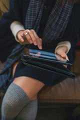 Detail of a girl working on her tablet