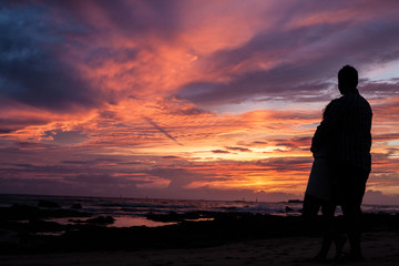 Couple in a sunset at beach