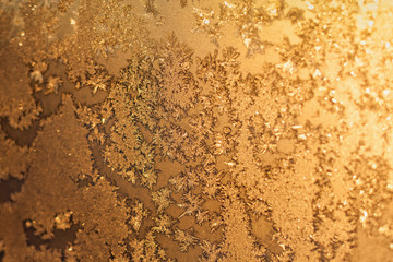 Snowflakes and ice on frozen window