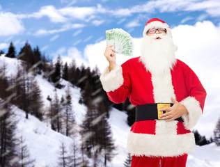 man in costume of santa claus with euro money