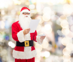 man in costume of santa claus with letter