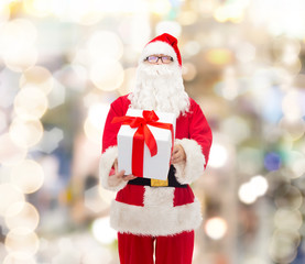 man in costume of santa claus with gift box
