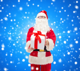 man in costume of santa claus with gift box