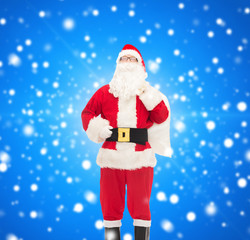 man in costume of santa claus with bag