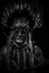 traditional Native, American Indian chief with big feather headd