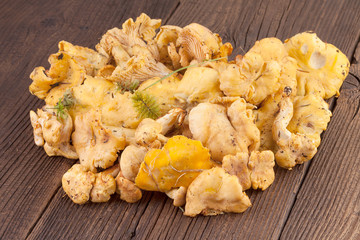 Chanterelles Mushrooms on Wooden background