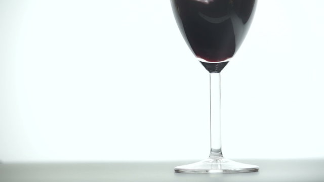 Pouring red wine, closeup