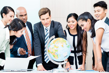Business team discussing global market intelligence