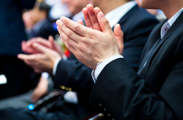 applauding at meeting